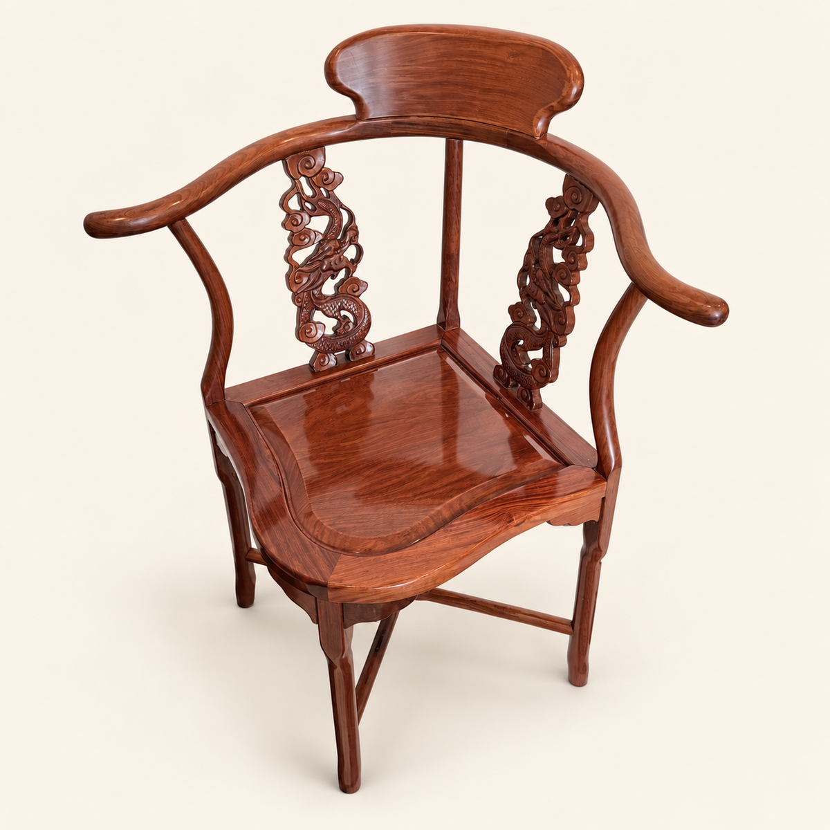 Horseshoe back and out-turned arms of rosewood corner chair