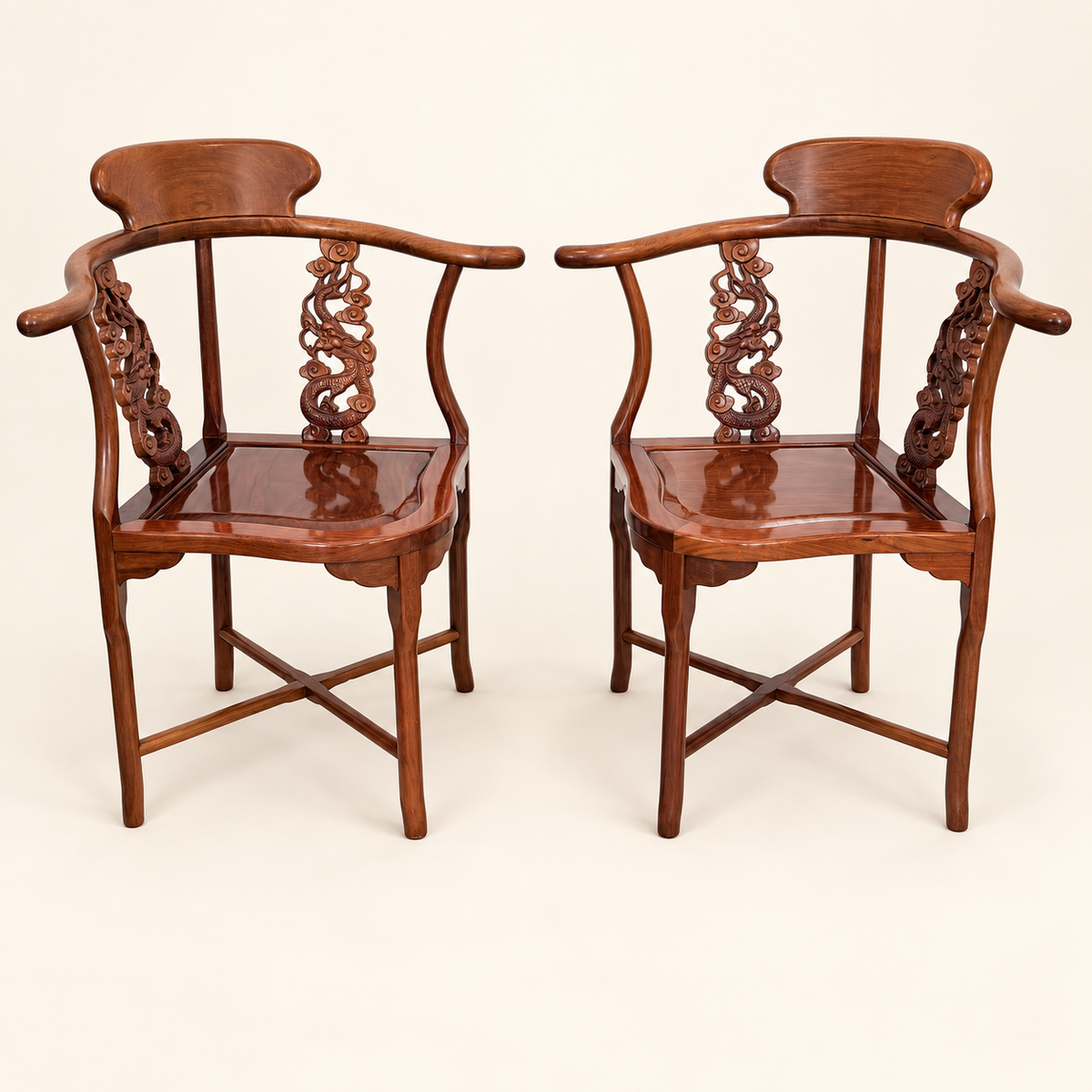 Pair of Chinese rosewood horseshoe corner chairs with carved splats