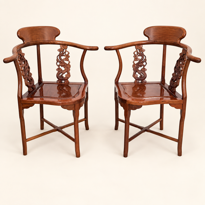 Pair of Chinese rosewood horseshoe corner chairs with carved splats