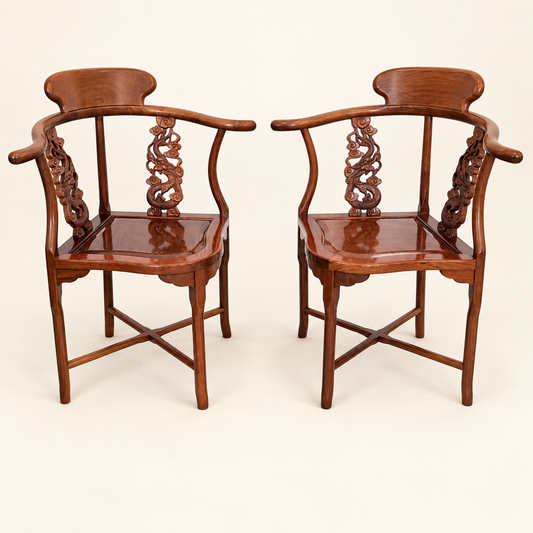 Pair of Chinese rosewood horseshoe corner chairs with carved splats