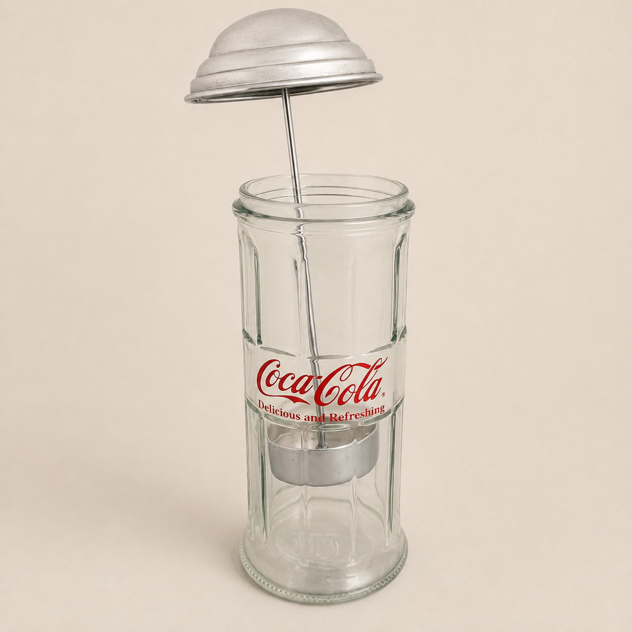 Coca-Cola straw dispenser with the domed lid and straw lifter raised
