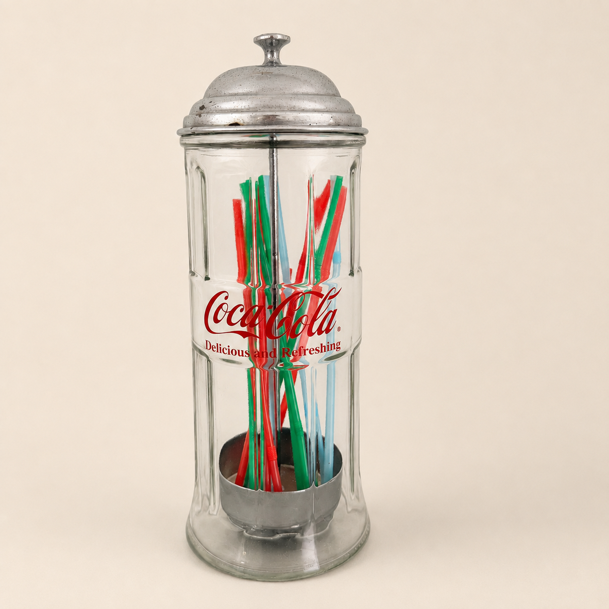 Coca-Cola straw dispenser filled with colorful straws, front view