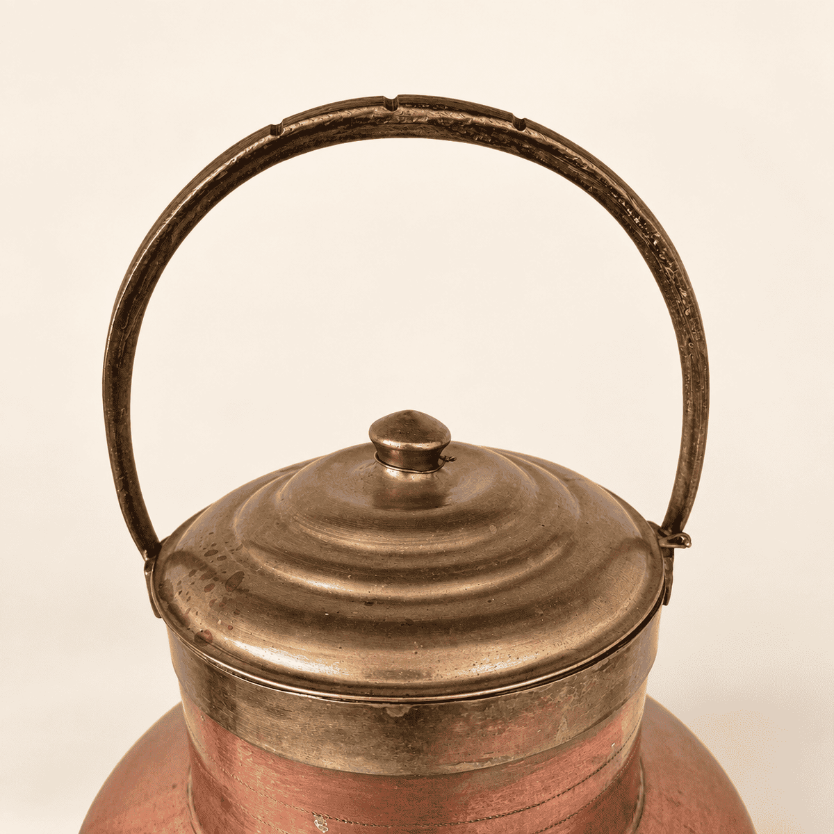 Copper ewer open with the brass lid lifted off, tin-lined interior