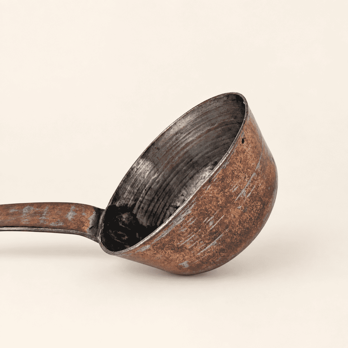 Deep tin-lined bowl of the dipper and the forged handle joint, close view