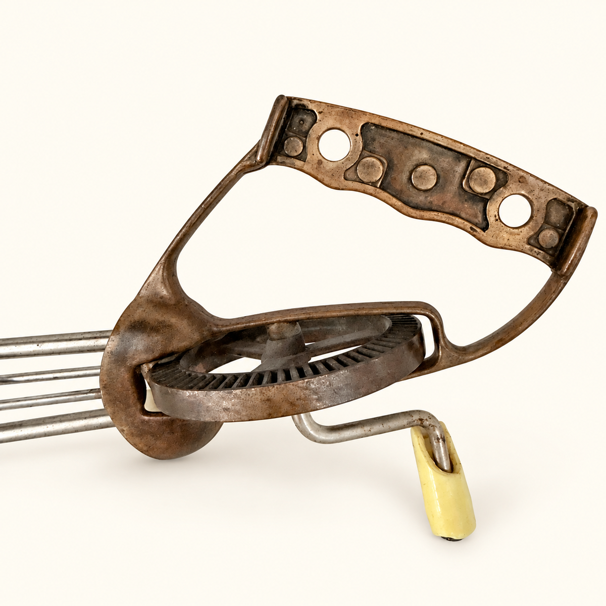 Copper D-grip handle, toothed drive wheel, and the cream crank knob