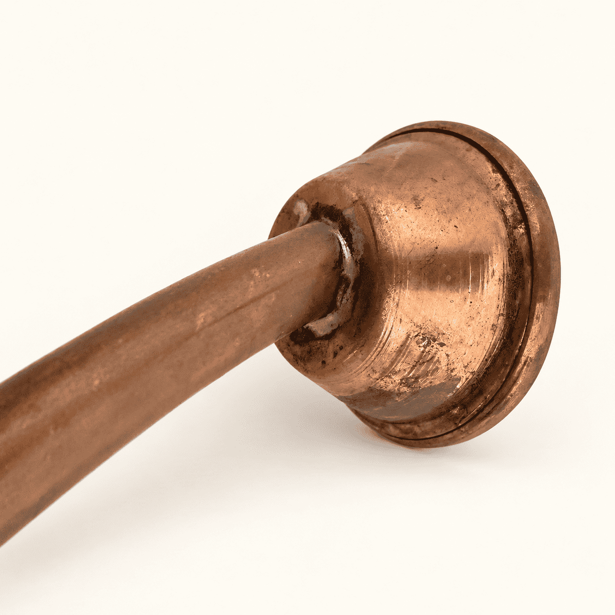 Close detail of the perforated rose head on the copper spout