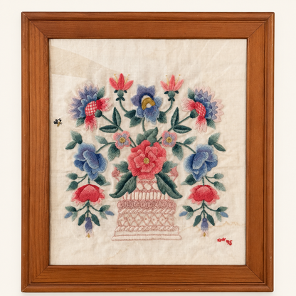 Framed hand embroidered crewel floral basket on linen