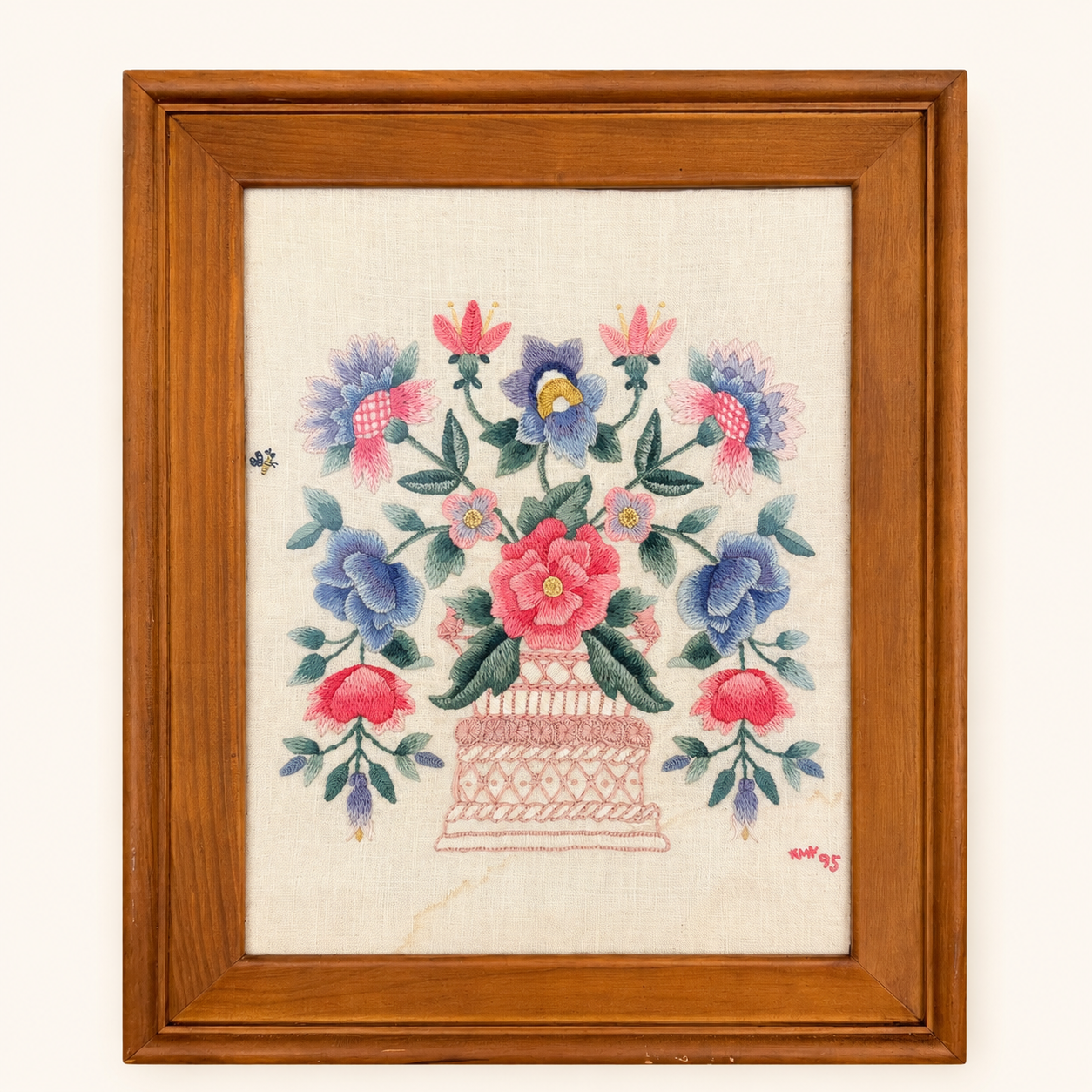 Embroidered initials and 95 date in corner