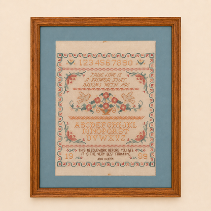 Framed cross stitch sampler with true love verse, doves, and floral basket