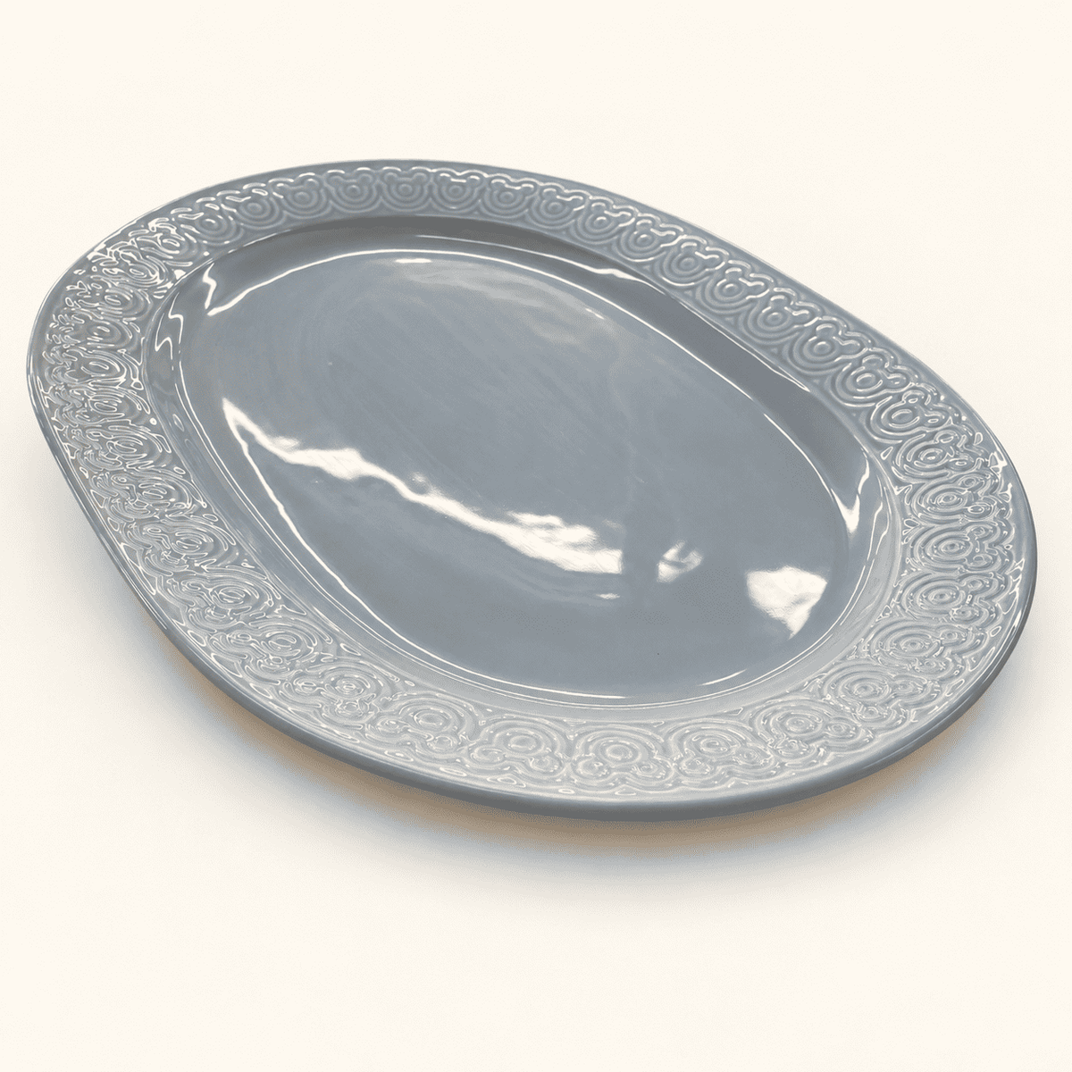 Blue gray Disney oval platter with a raised Mickey Mouse ears border, front view