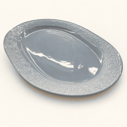 Blue gray Disney oval platter with a raised Mickey Mouse ears border, front view
