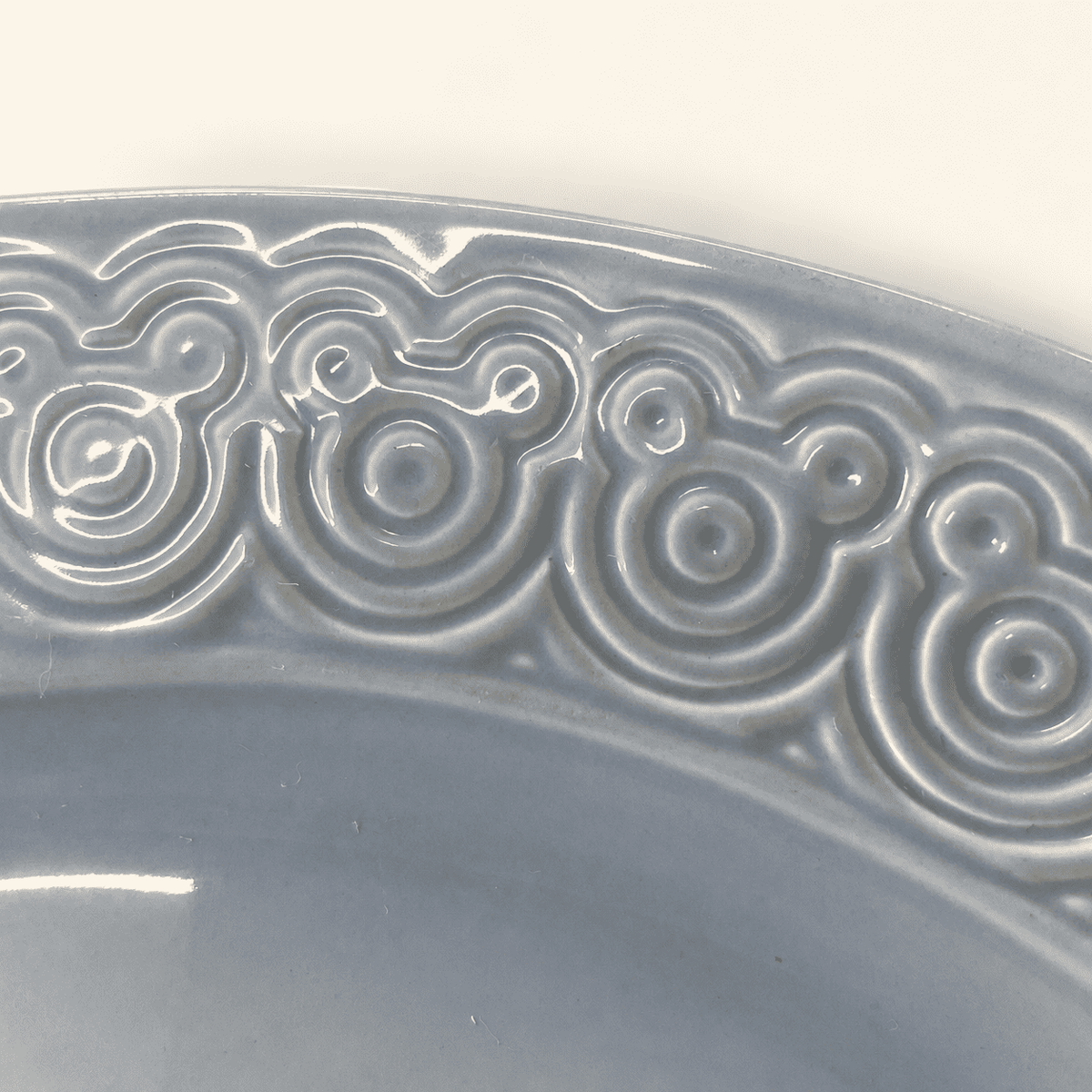 Close up of the embossed Mickey Mouse ears pattern on the platter rim