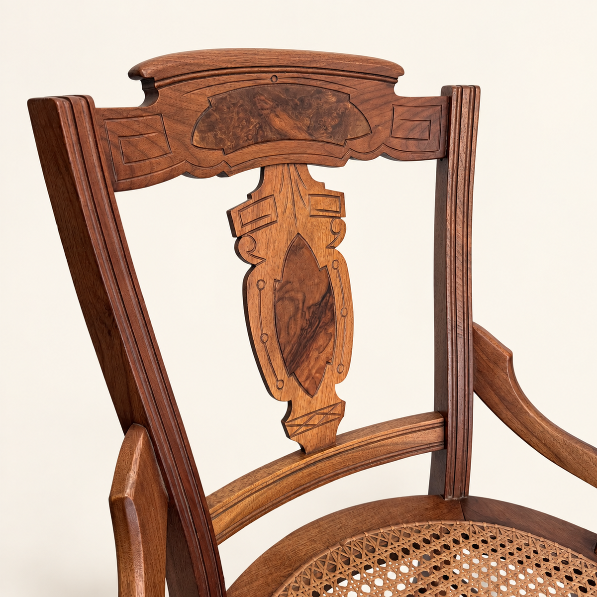 Eastlake walnut side chair with round hand-caned seat, front view