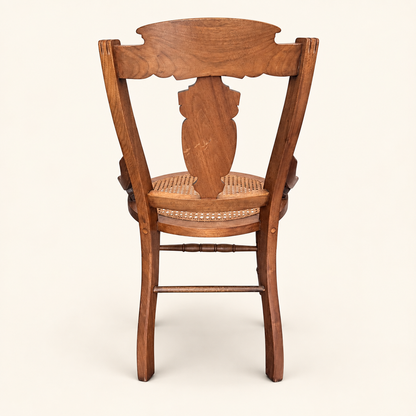 Turned faux-bamboo legs of an Eastlake walnut chair