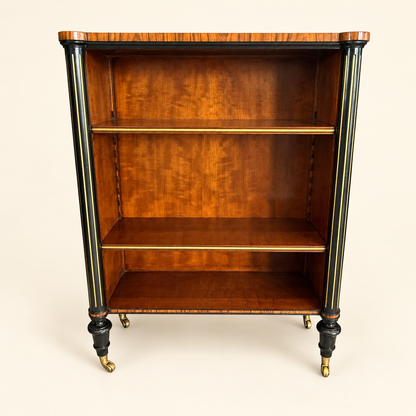 Antique Edwardian rosewood open bookcase with ebonized gilt columns and brass casters, front view