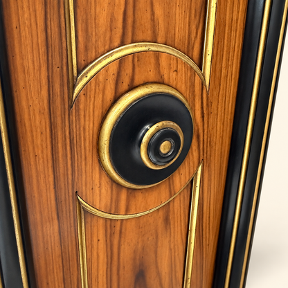 Close-up of ebonized and gilt roundel on rosewood side panel