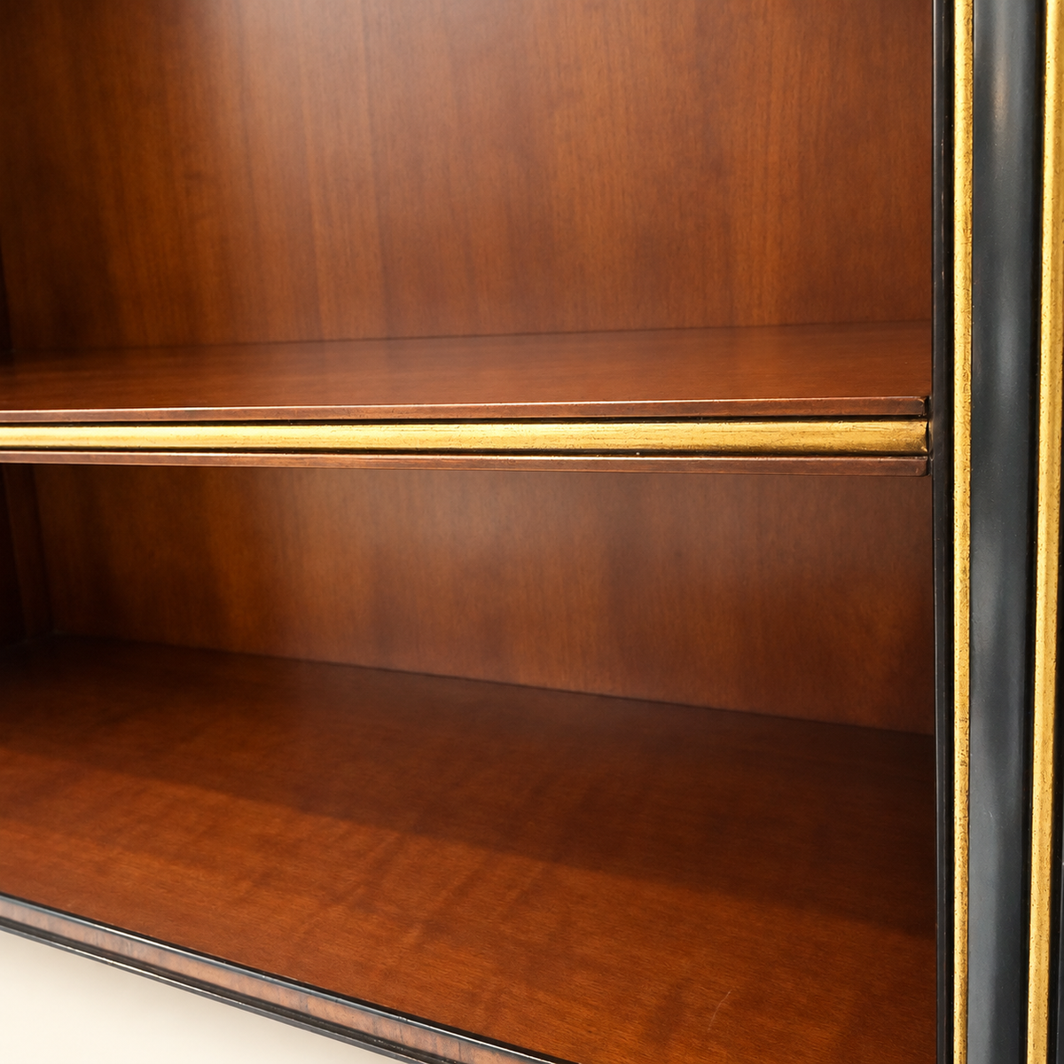 Adjustable shelf with gilt molding inside Edwardian rosewood bookcase