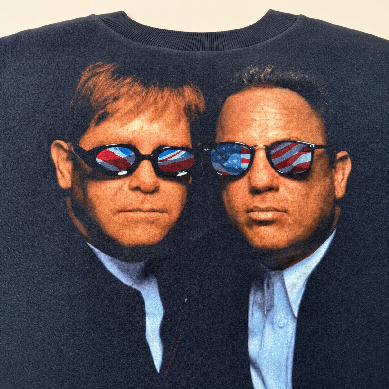 Close-up of Elton John and Billy Joel flag-lens sunglasses all-over print, clean uncracked graphic