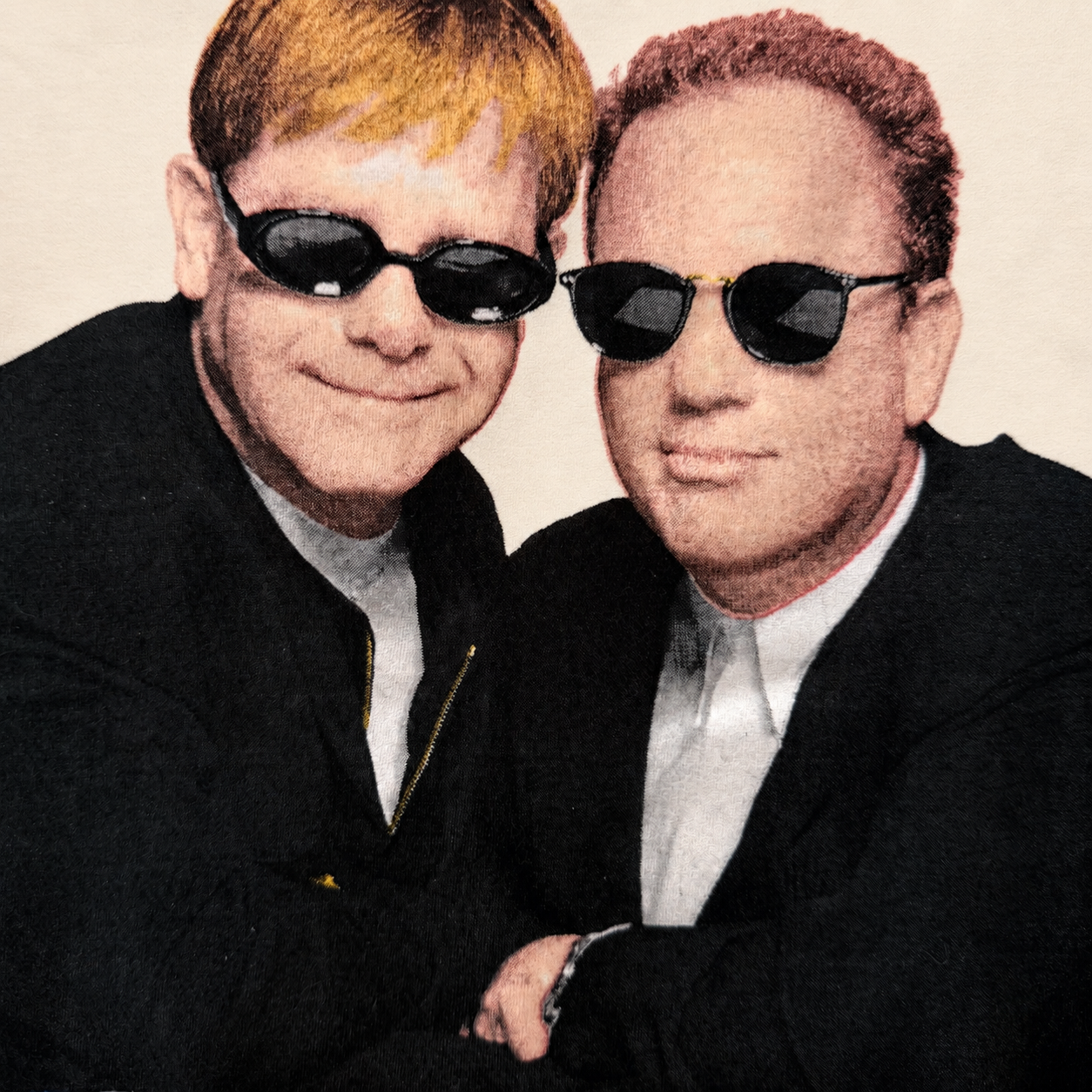 Close-up of Elton John and Billy Joel flag-sunglasses tour graphic, clean uncracked print
