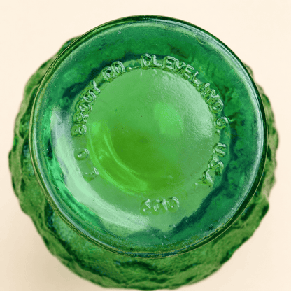 Base of E.O. Brody green crinkle glass vase showing Cleveland Ohio maker's mark