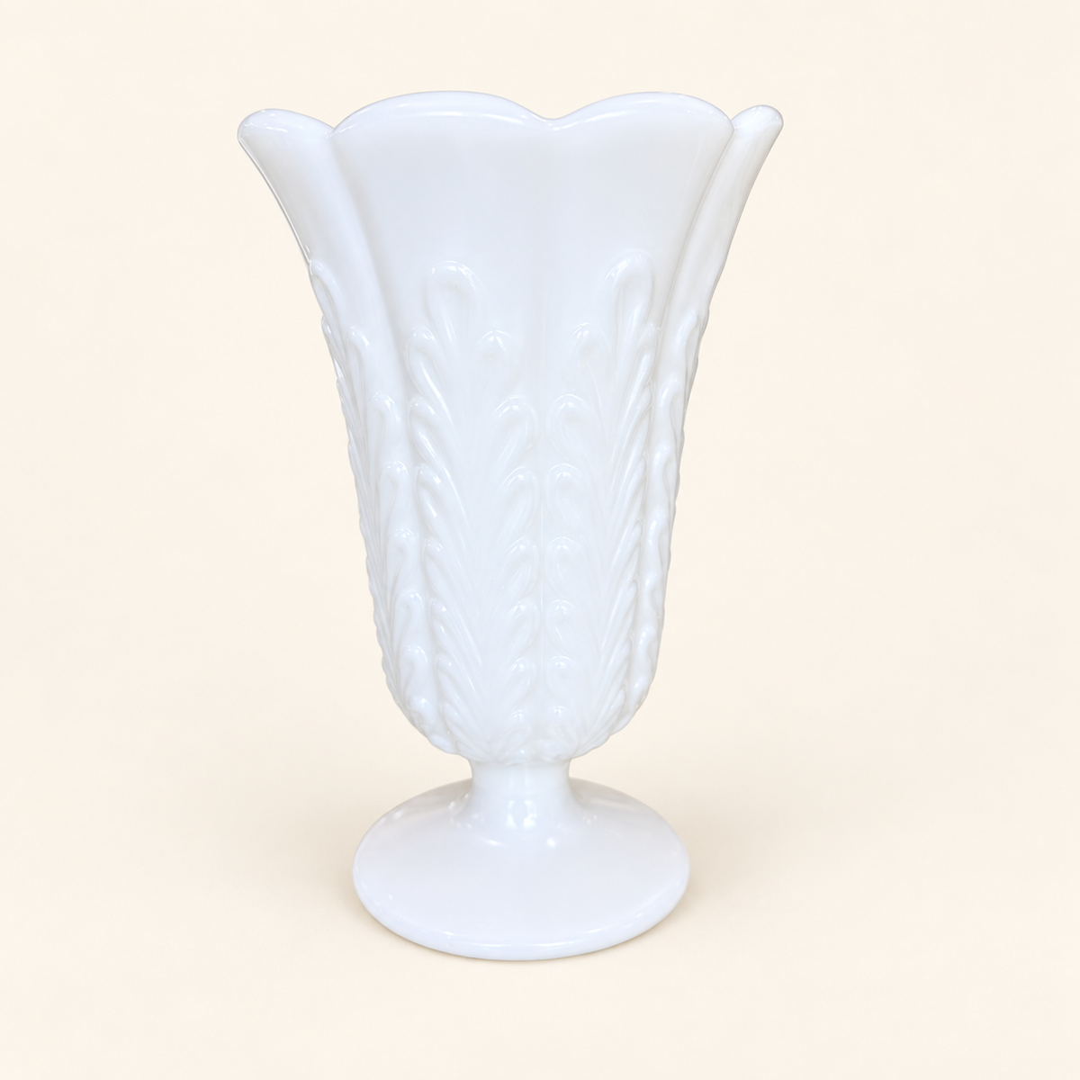 E.O. Brody milk glass footed vase with scalloped rim and embossed plume pattern