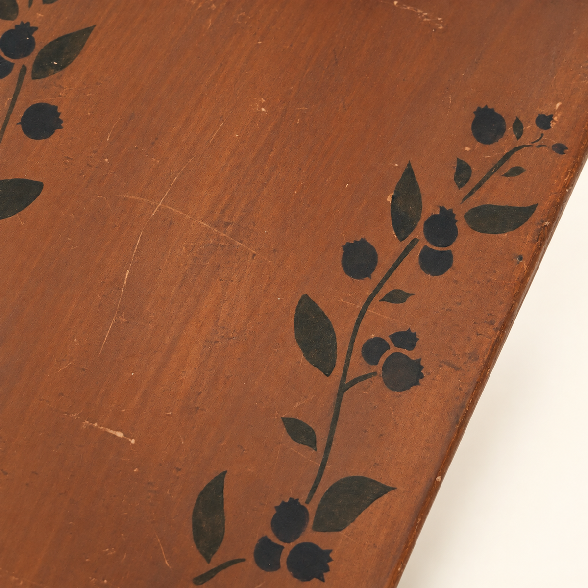 Blueberry-stenciled wooden step stool, side view