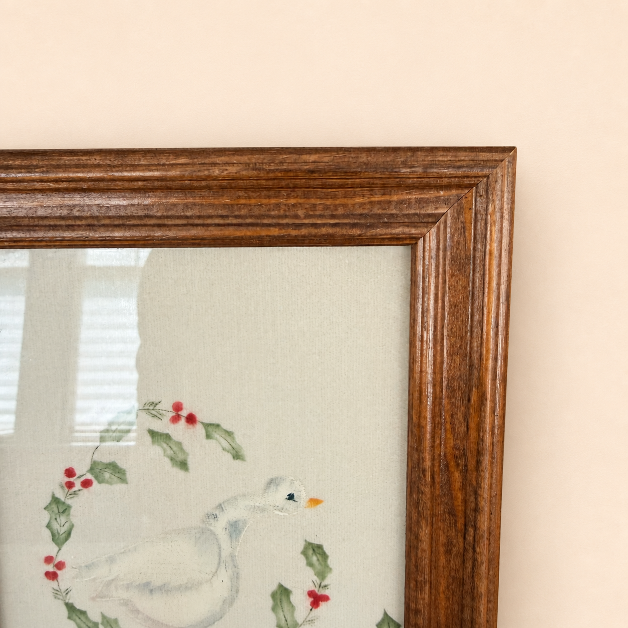 Corner of oak frame with goose artwork