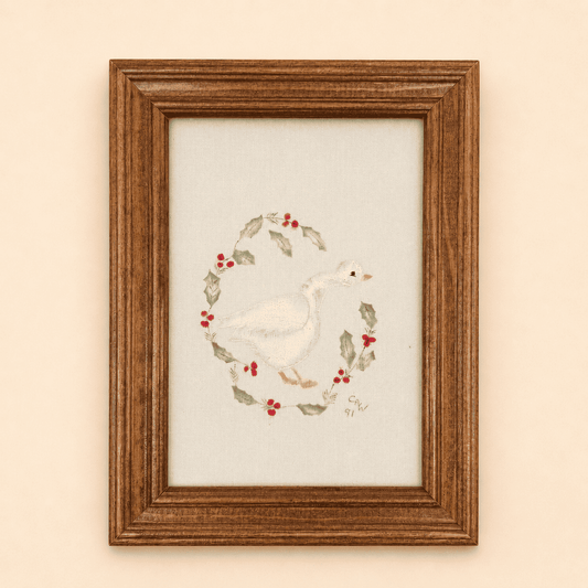 Framed goose embroidery with painted holly wreath, signed 1991
