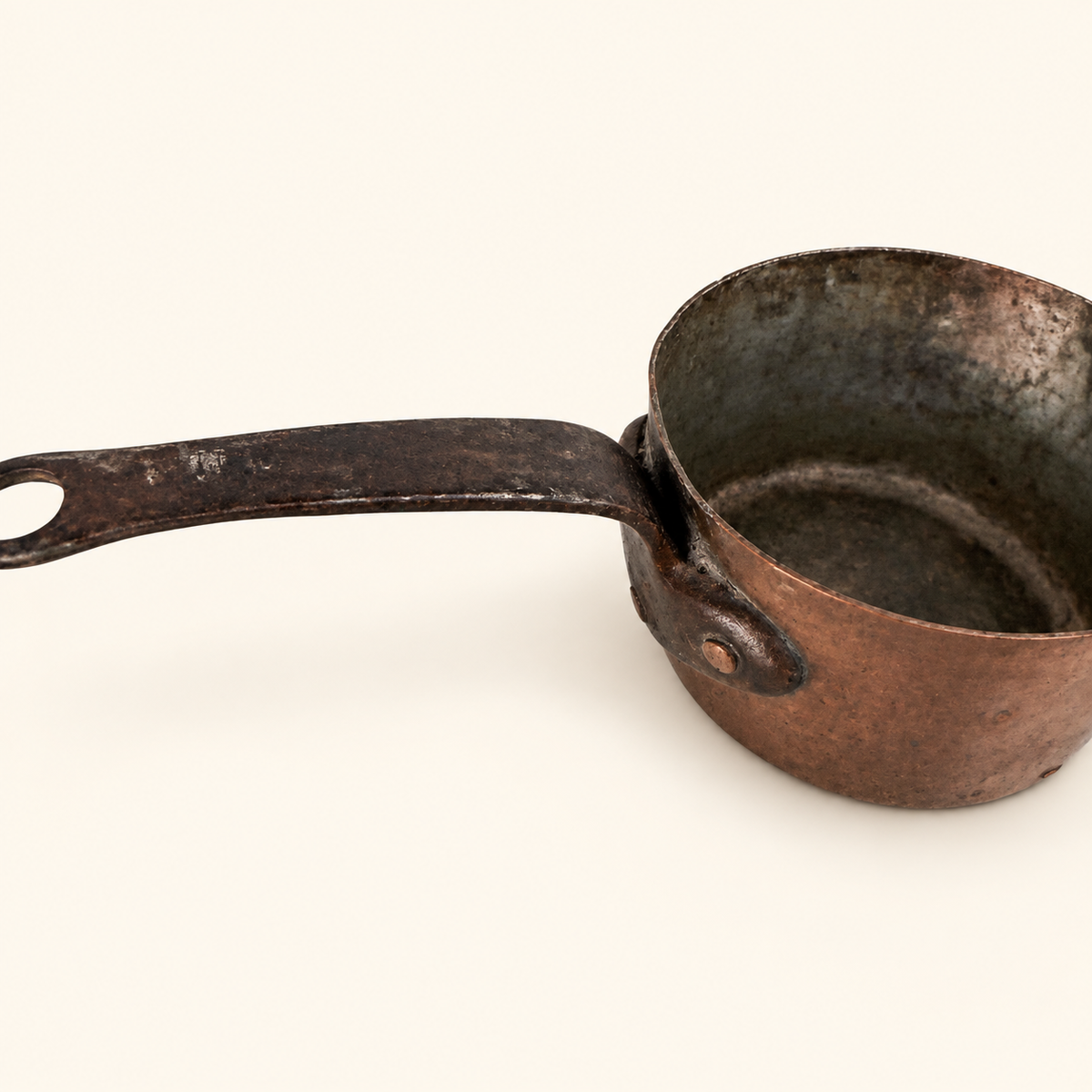 Forged iron handle riveted to the copper body with copper rivets, tin interior