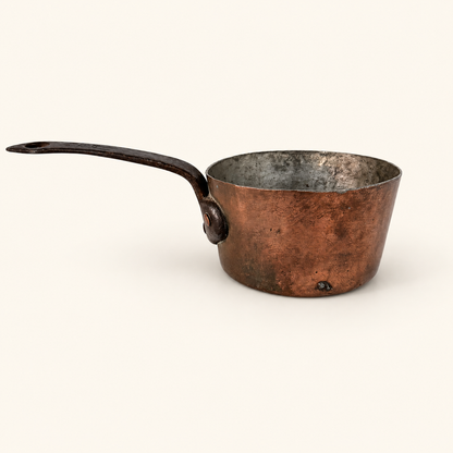 Antique French copper saucepan in profile, tin-lined with a forged iron handle