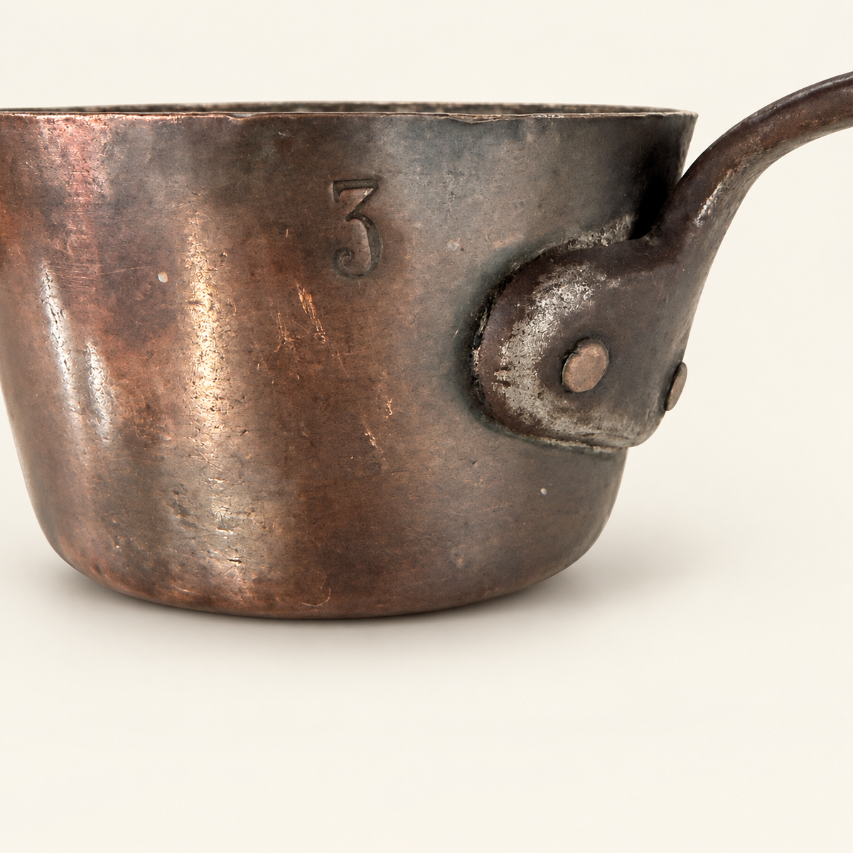 Stamped size 3 on the copper body beside the riveted iron handle