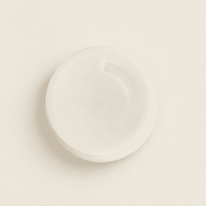 Underside of the milk glass sugar dispenser
