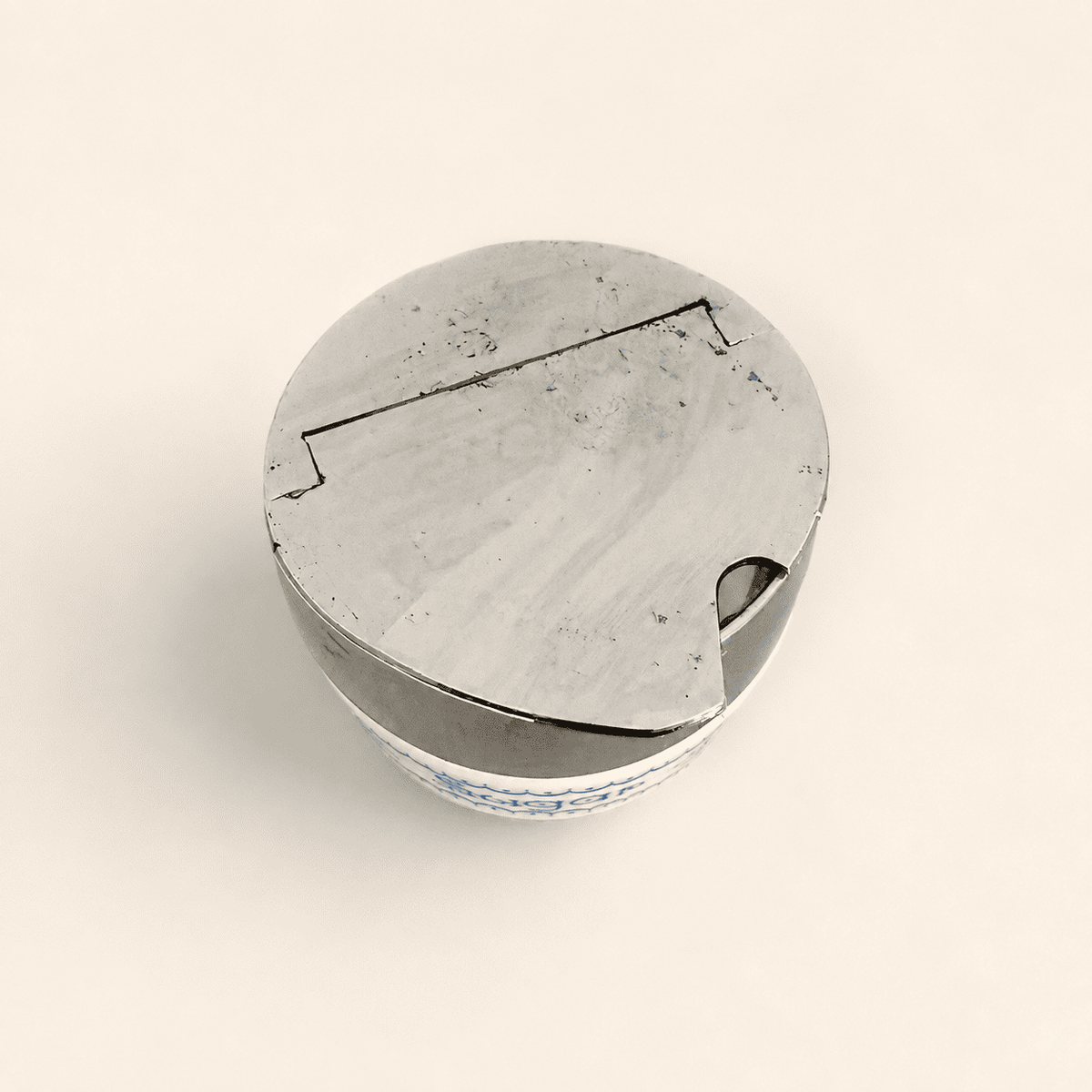 Top-down view of the closed chrome flip-top lid