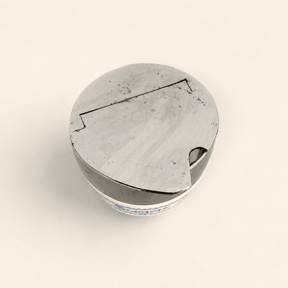 Top-down view of the closed chrome flip-top lid