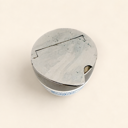 Top-down view of the closed chrome flip-top lid