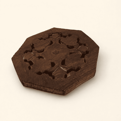 Angled view of the octagonal carved wood trivet