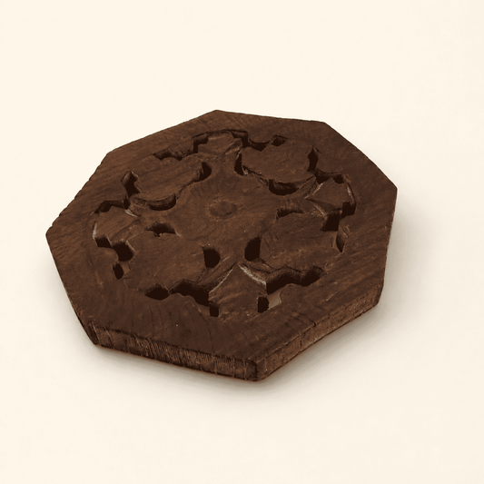 Angled view of the octagonal carved wood trivet