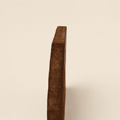Side profile of the hand-carved wood trivet showing thickness