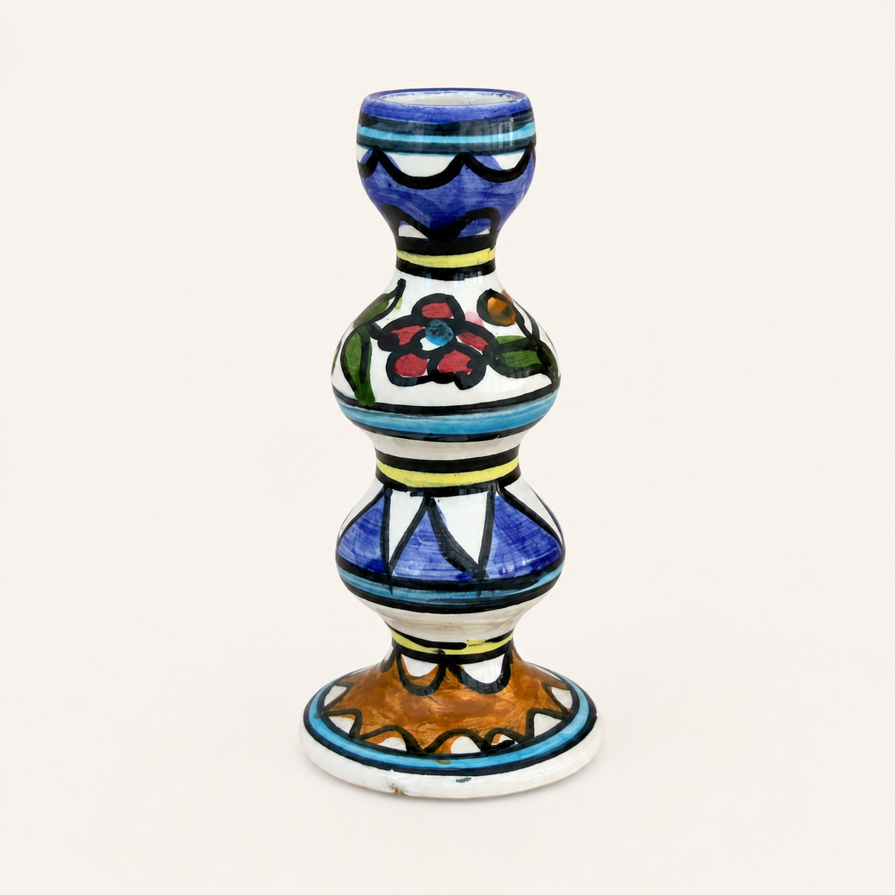 Single hand-painted ceramic candle holder with blue and floral design