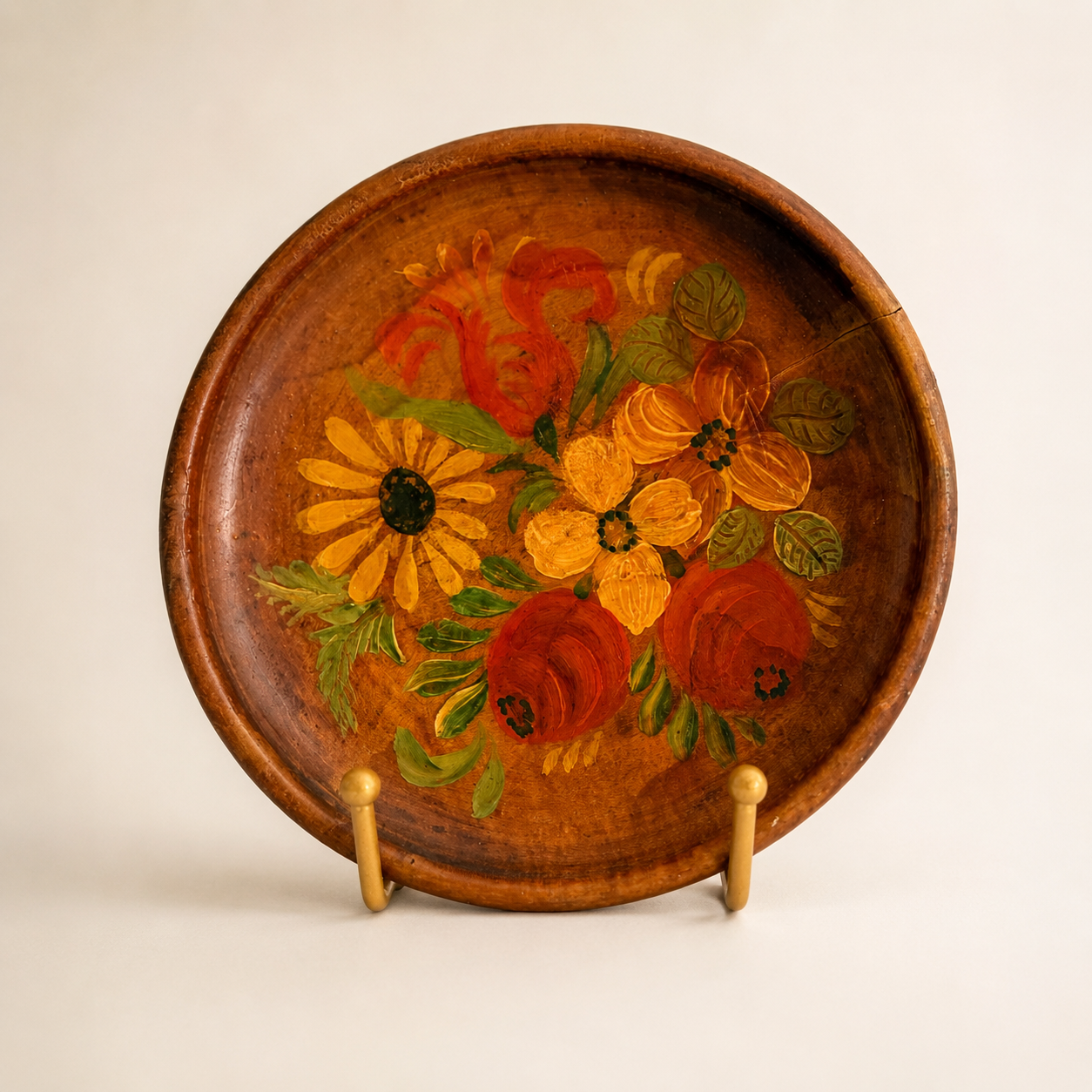 Hand-painted folk floral wood plate with roses and daisy bouquet, front view on stand