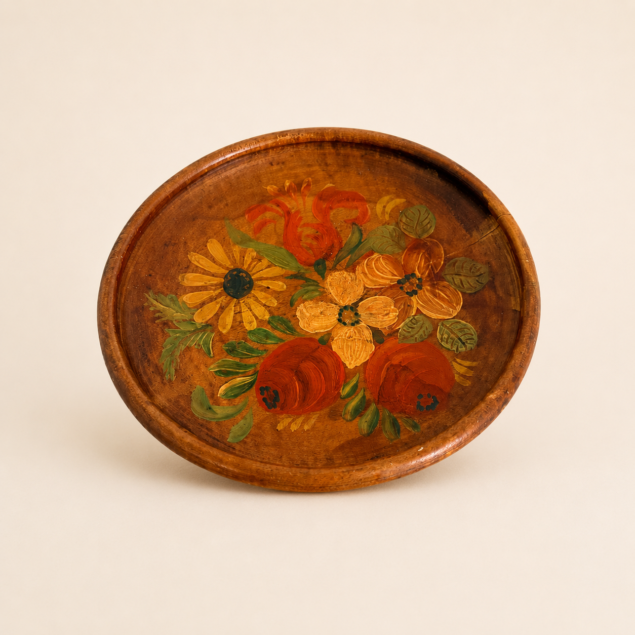 Overhead view of hand-painted floral wood plate showing full bouquet