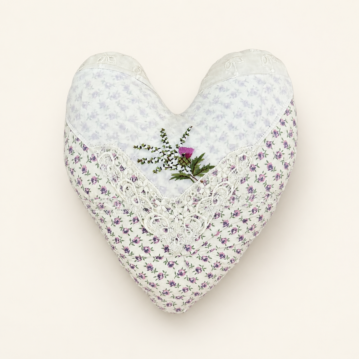 Handmade heart pillow in vintage lilac florals with lace and embroidered thistle, front view
