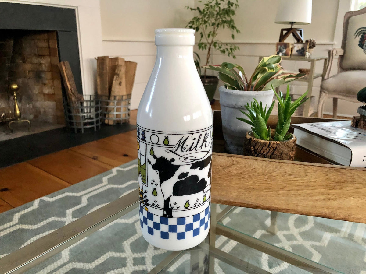 Alan Wood for Lillian Vernon milk glass bottle with a black and white cow and the word Milk