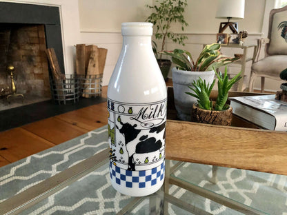 Alan Wood for Lillian Vernon milk glass bottle with a black and white cow and the word Milk