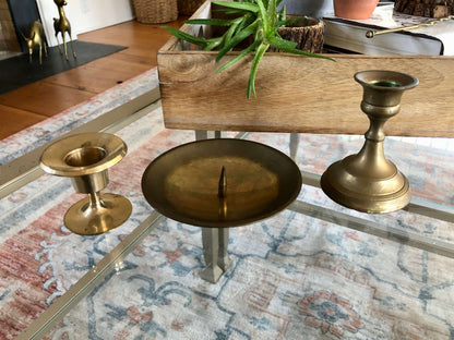 Vintage brass candlesticks — overhead view of the graduated set