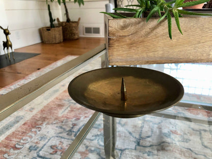 Vintage brass candlesticks grouped on a table