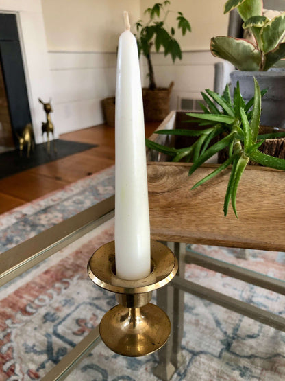 Vintage brass candlesticks styled in a living room