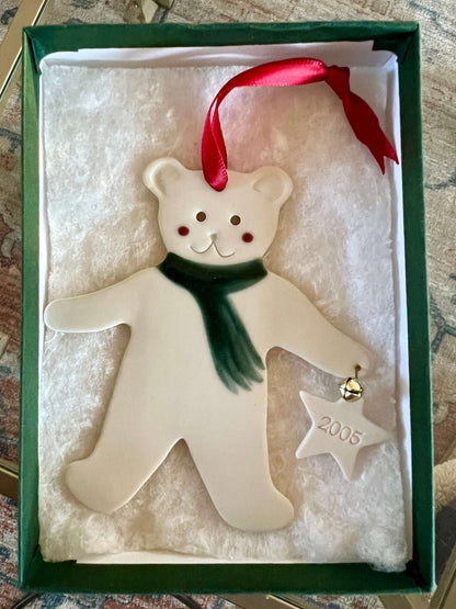 Handmade ceramic Christmas ornament of a bear in a green scarf holding a 2005 star, from Vermont