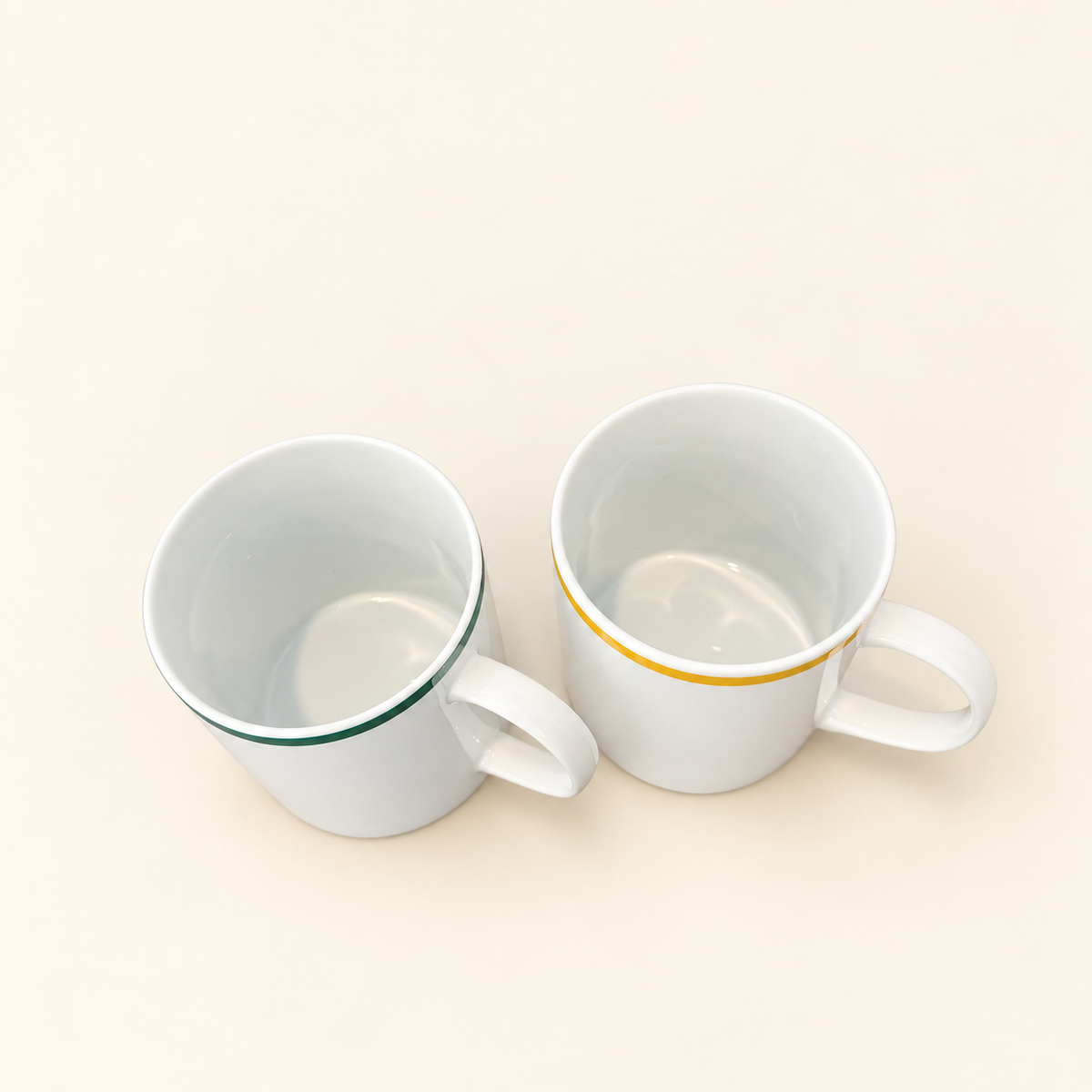 Two Japanese cafe-style white ceramic mugs
