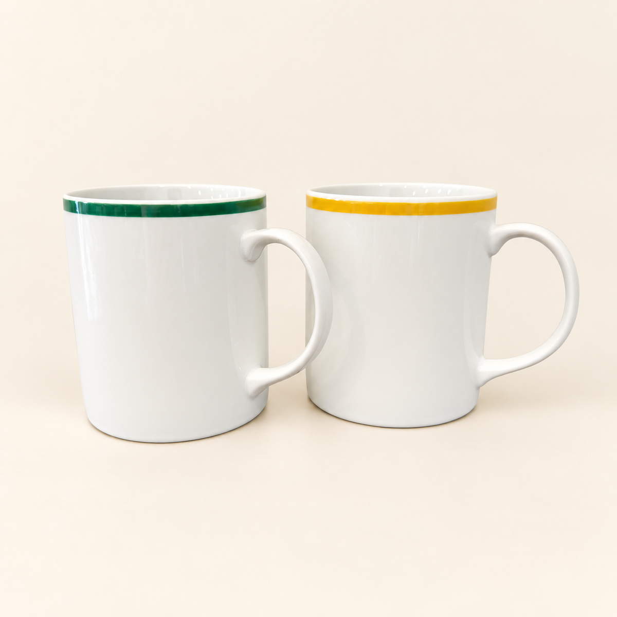 Pair of vintage Japanese ceramic mugs with yellow and green rims